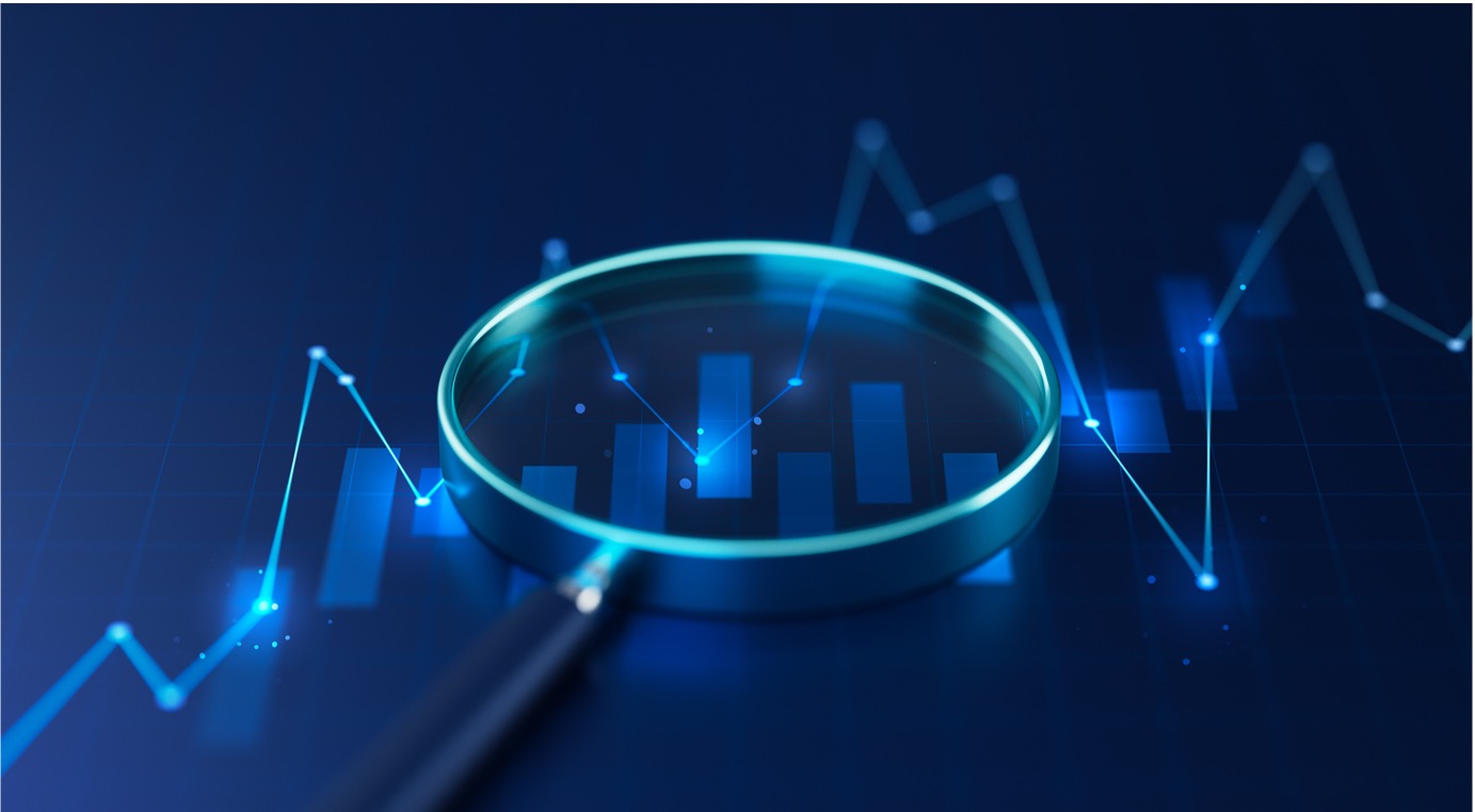 Magnifying glass inspects graph trends