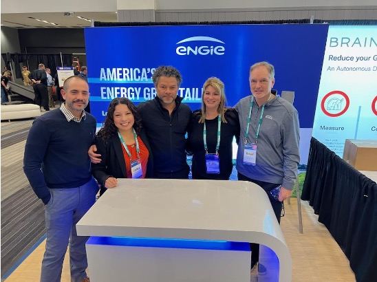 Engie employees standing in front of a ENGIE booth.